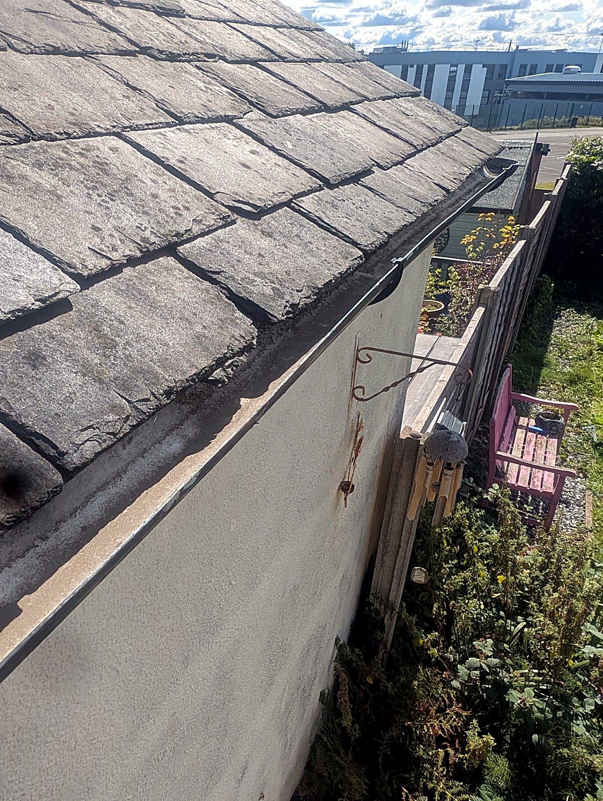 Clean gutter on a slate roof after professional gutter cleaning in Bury, Greater Manchester