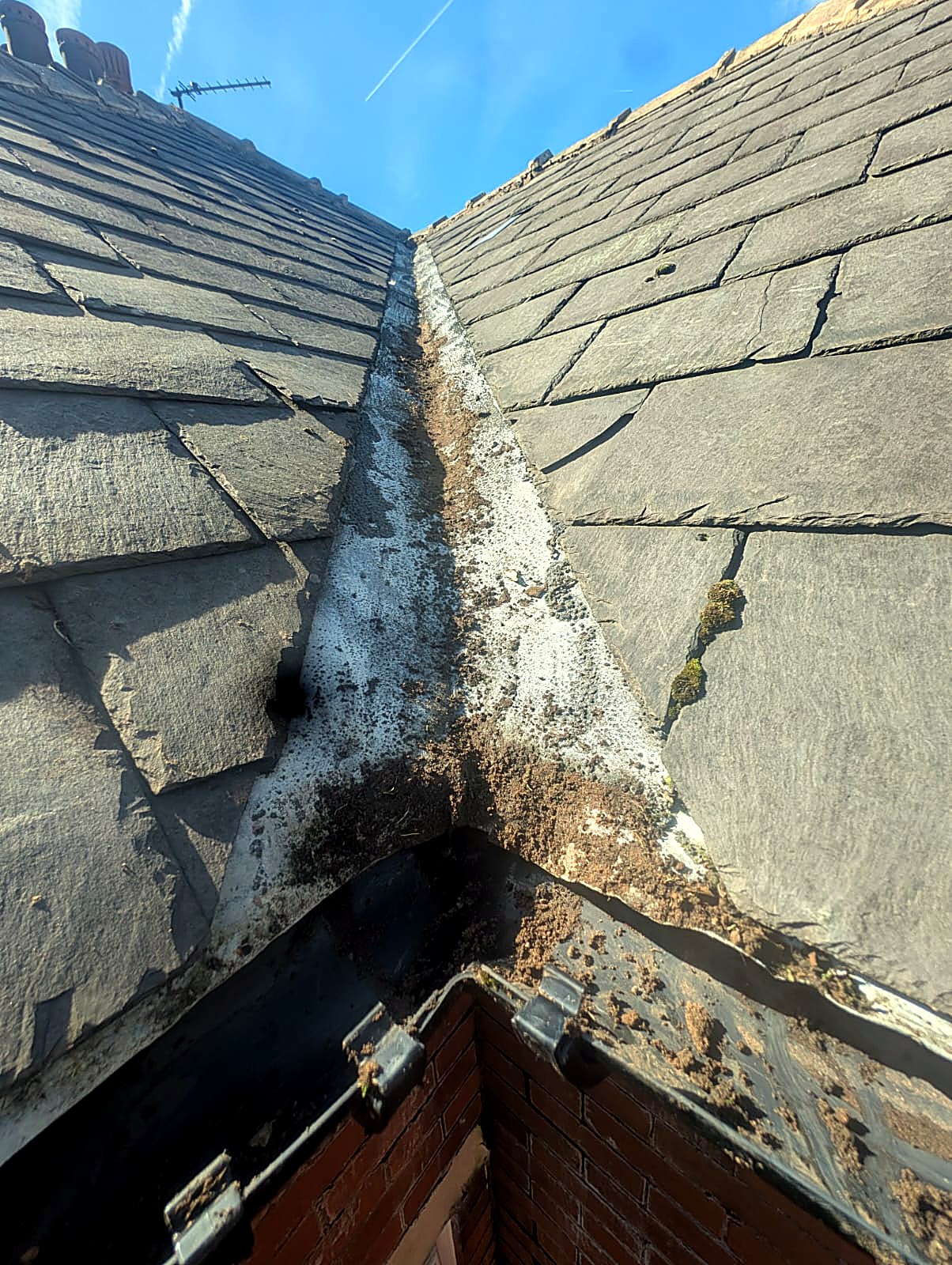 Clean roof valley gutter after valley gutter clearance in Bury, Greater Manchester